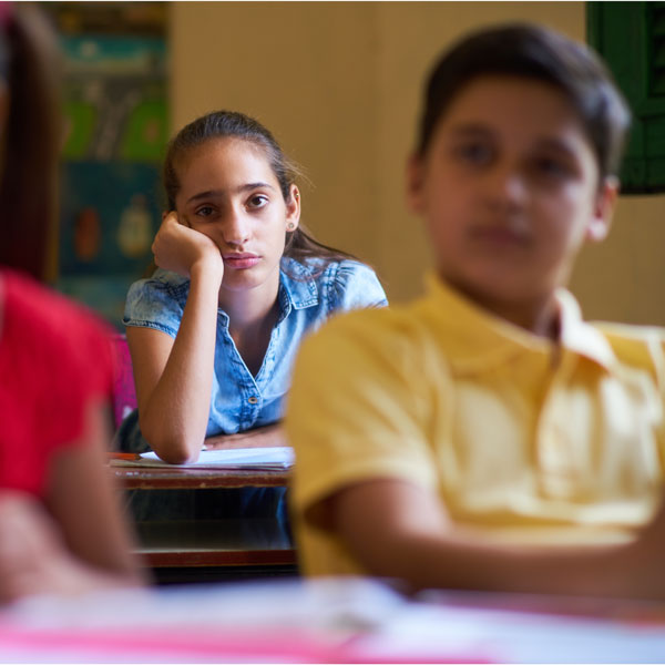 A bored female student in class