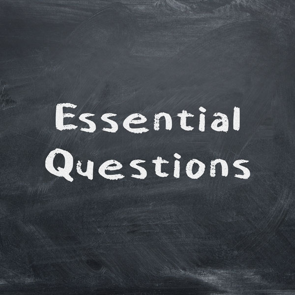 Essential Questions written on a chalk board