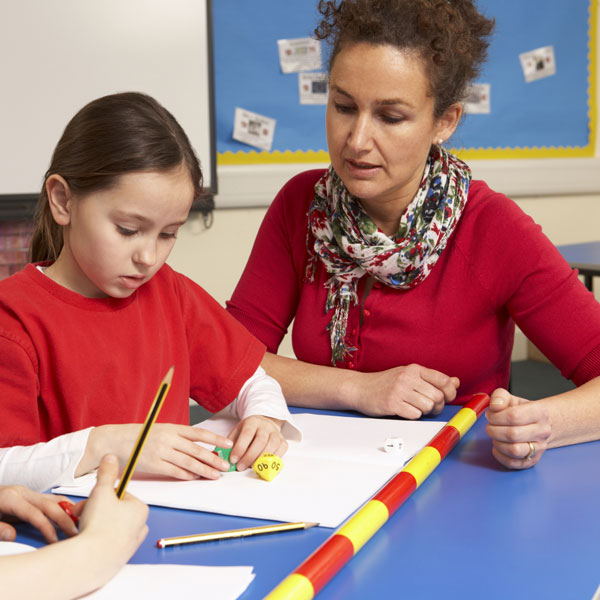 teacher explaining a game to a student