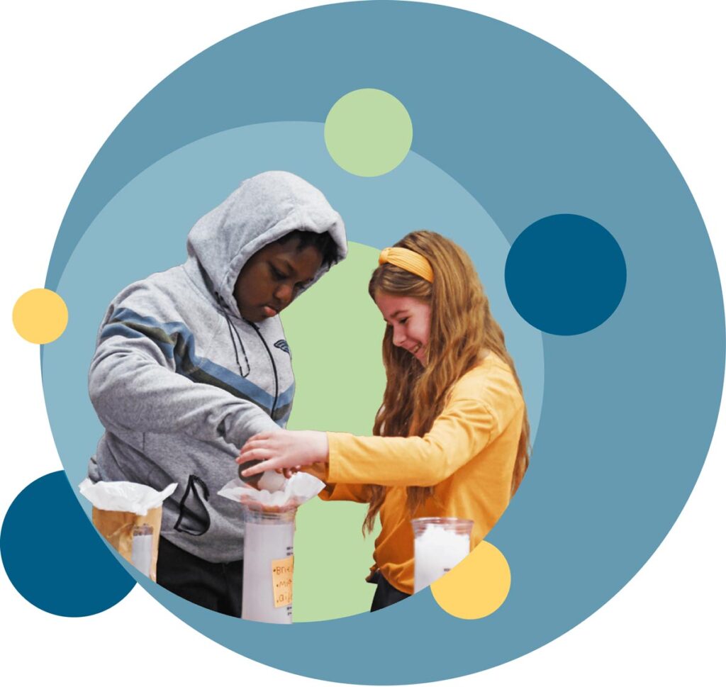 Tho middle school students conducting a science experiment