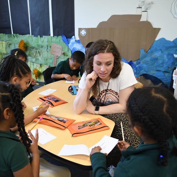 Teacher Directing a Coloring Project